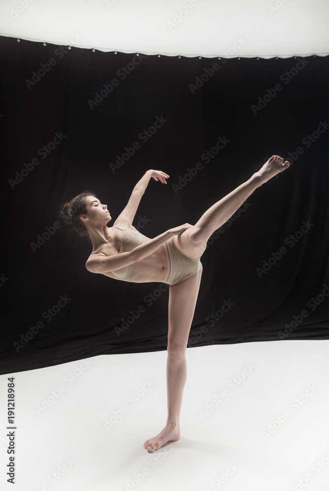 Young teen dancer on white floor background. Young teen dancer on white floor background.