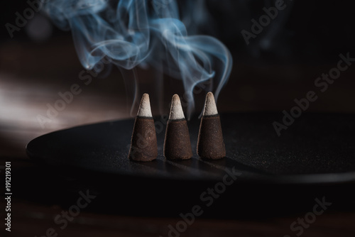 Εκτύπωση καμβά three burning incense sticks with blue smoke