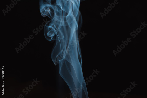 blue and white smoke isolated on black