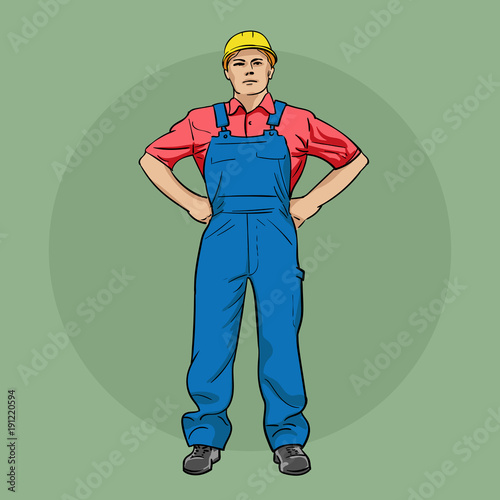 Worker in overalls and a helmet.