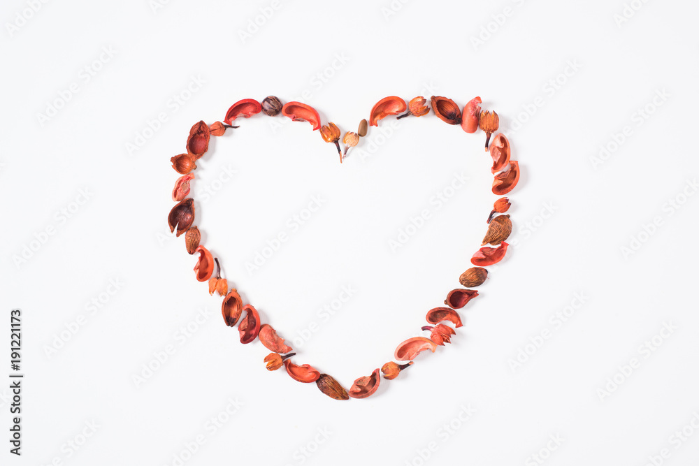 top view of heart from dried fruits isolated on white