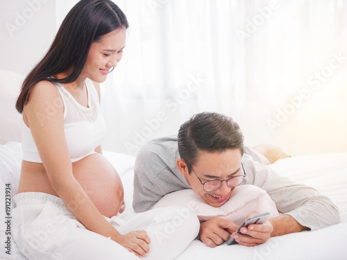 Happy pregnant woman and her husband waiting for baby, happy family love and care.