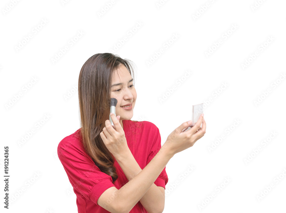 Closeup asian woman are making up by press powder isolated on white background in cosmetic concept