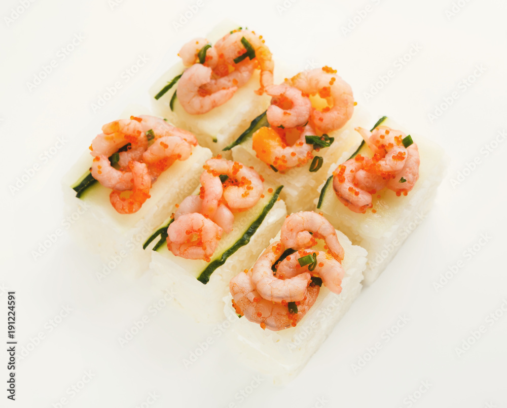 Set of rolls with soft cheese and shrimps on top, isolated Set of rolls with soft cheese and shrimps on top, isolated