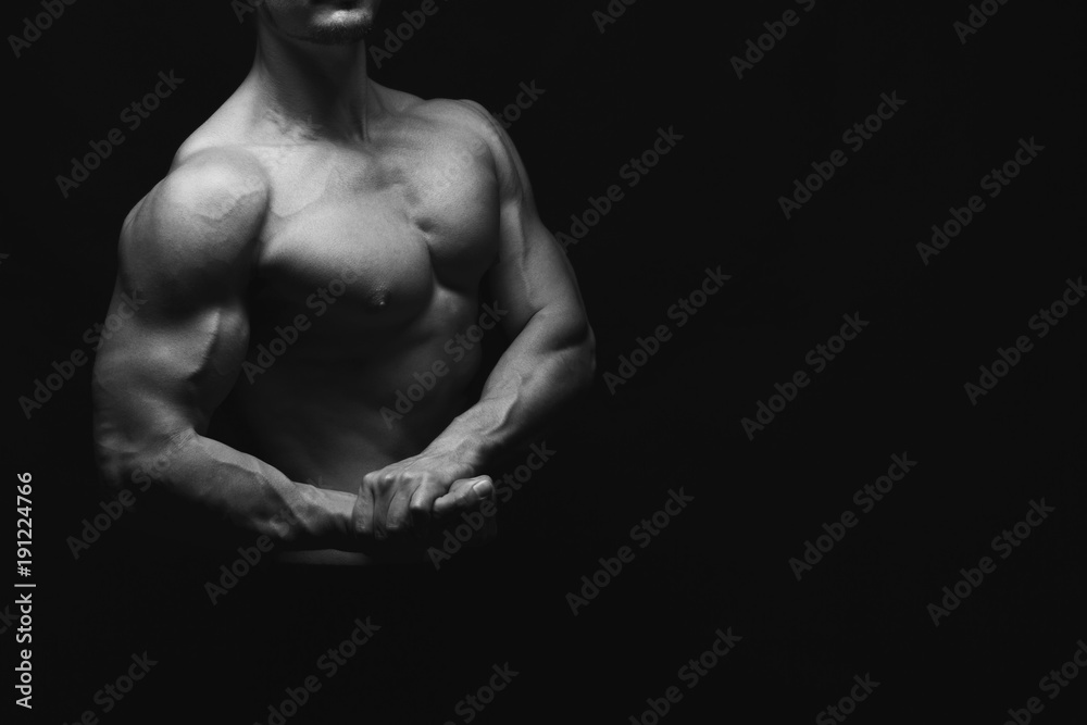 Strong athletic man showes naked muscular body Strong athletic man showes naked muscular body