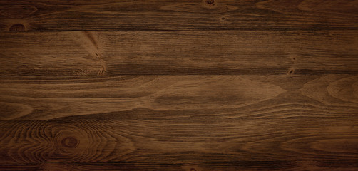 Dark stained wood boards with grain and texture. Flat wood background with parallel horizontal lines.