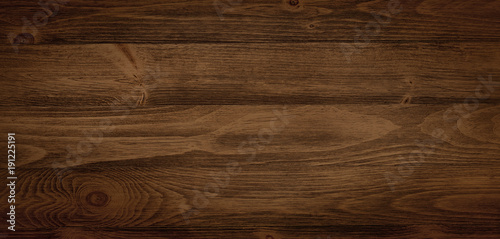 Dark stained wood boards with grain and texture. Flat wood background with parallel horizontal lines. photo