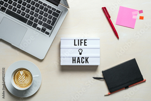 Fototapeta Naklejka Na Ścianę i Meble -  Life hack written on lightbox in office as flatlay
