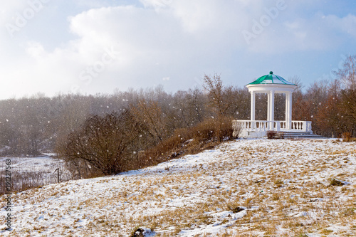 Gazebo in historical park Home of the Gentry in the winter snowstorm, Oryol. Russia photo