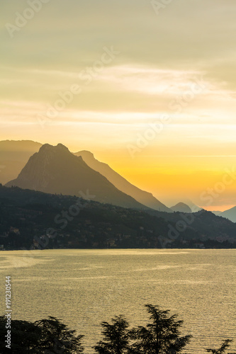 Lake Garda, Italy. peaceful sunset looking out over the lake from Maraschina toward the mountains