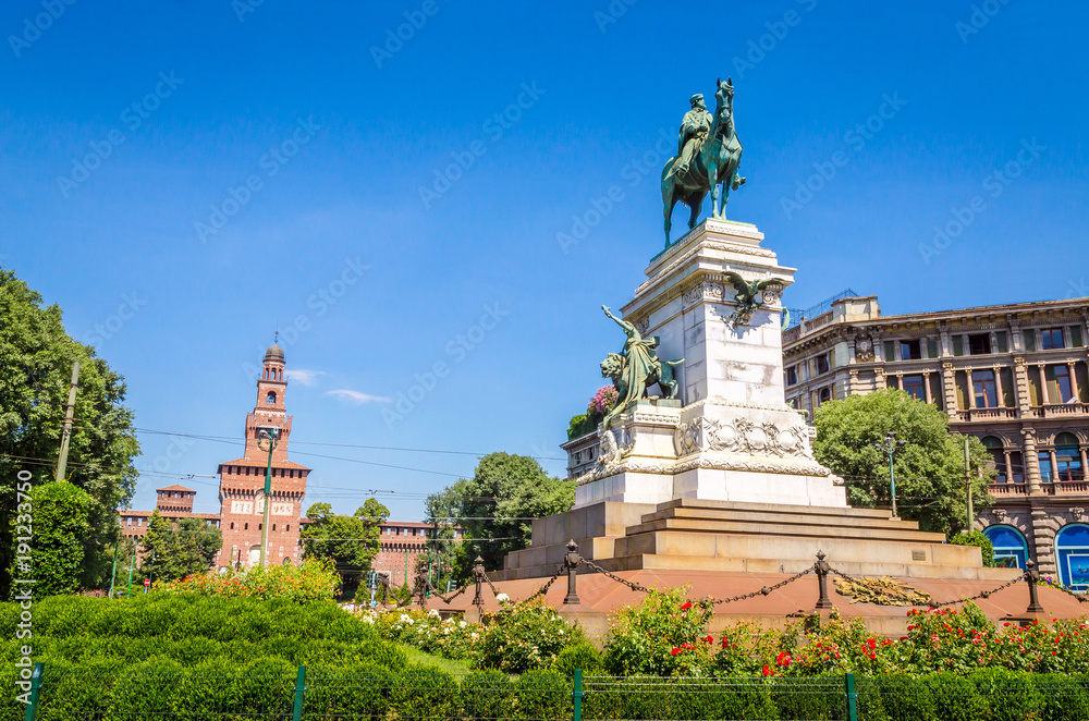 Giuseppe Garibaldi Monument and tower of Sforza Castle - Castello Sforzesco in Milan, Italy
