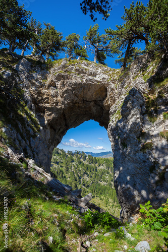 Amazing natural arch Suplja Vrata in Prokletije Mountain National Park, Montenegro