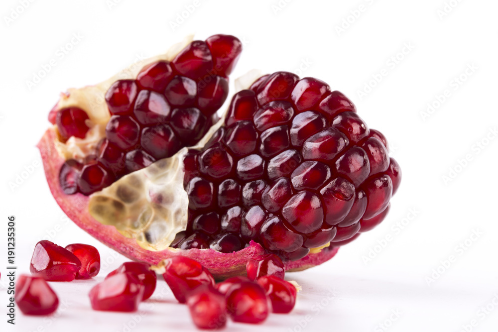 fresh pomegranate isolated onblack background close-up fresh pomegranate isolated onblack background close-up
