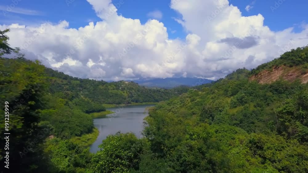 Aerial view of calm river in ceylon hills at sunny day drone footage Aerial view of calm river in ceylon hills at sunny day drone footage