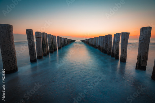 Wallpaper Mural Dishoek wavebreakers at sunset Torontodigital.ca