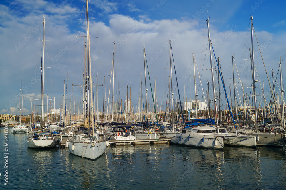 Sailing ships and yachts moored in Port of Barcelona, Spain