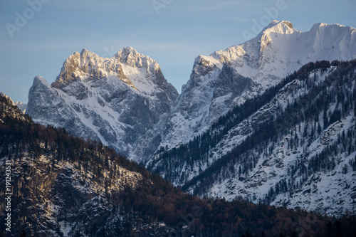 Golden sun rays caressing the tall, rugged peaks of the Austrian Alps near the town of Kufstein in Tyrol