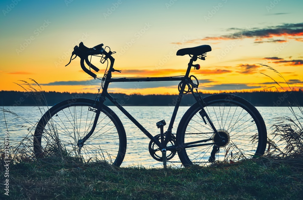 Active sunrise at the lake. Bike in a beautiful colorful scenery. Active sunrise at the lake. Bike in a beautiful colorful scenery.