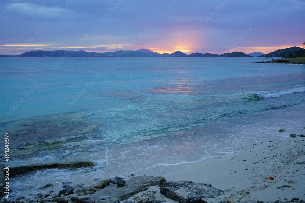Sunset over a tropical beach and the Caribbean Sea in St John, U.S. Virgin Islands