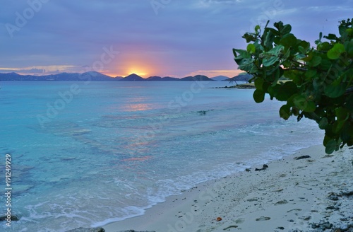 Sunset over a tropical beach and the Caribbean Sea in St John, U.S. Virgin Islands photo