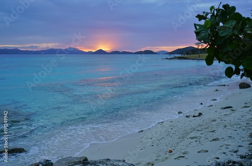 Sunset over a tropical beach and the Caribbean Sea in St John, U.S. Virgin Islands photo