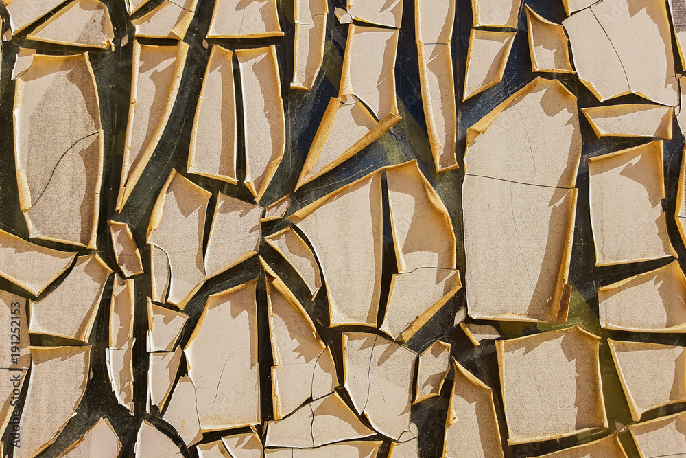 Detail of yellow cracked from the heat paint texture background 