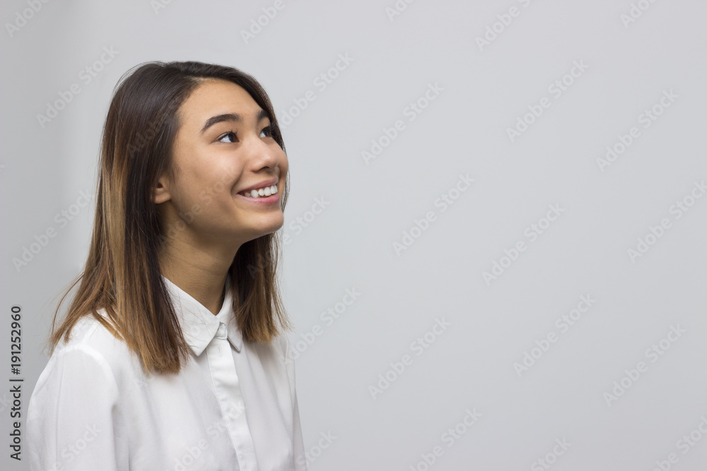 Indoor portrait of young pretty asian woman looking up and wondering. Happy lifestyle concept. Selective focus and shallow DOF. Indoor portrait of young pretty asian woman looking up and wondering. Happy lifestyle concept. Selective focus and shallow DOF.