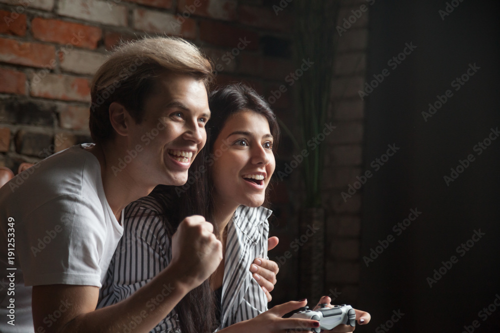 Premium Photo  Pov of young couple using console to play videogames  challenge, doing online competition on cyberspace. focused boyfriend and girlfriend  playing together to do fun leisure activity.