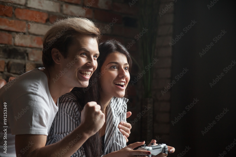 Young Cute Competitive Boyfriend Girlfriend Playing Video Games In Couch  Stock Photo, Picture and Royalty Free Image. Image 34313215.