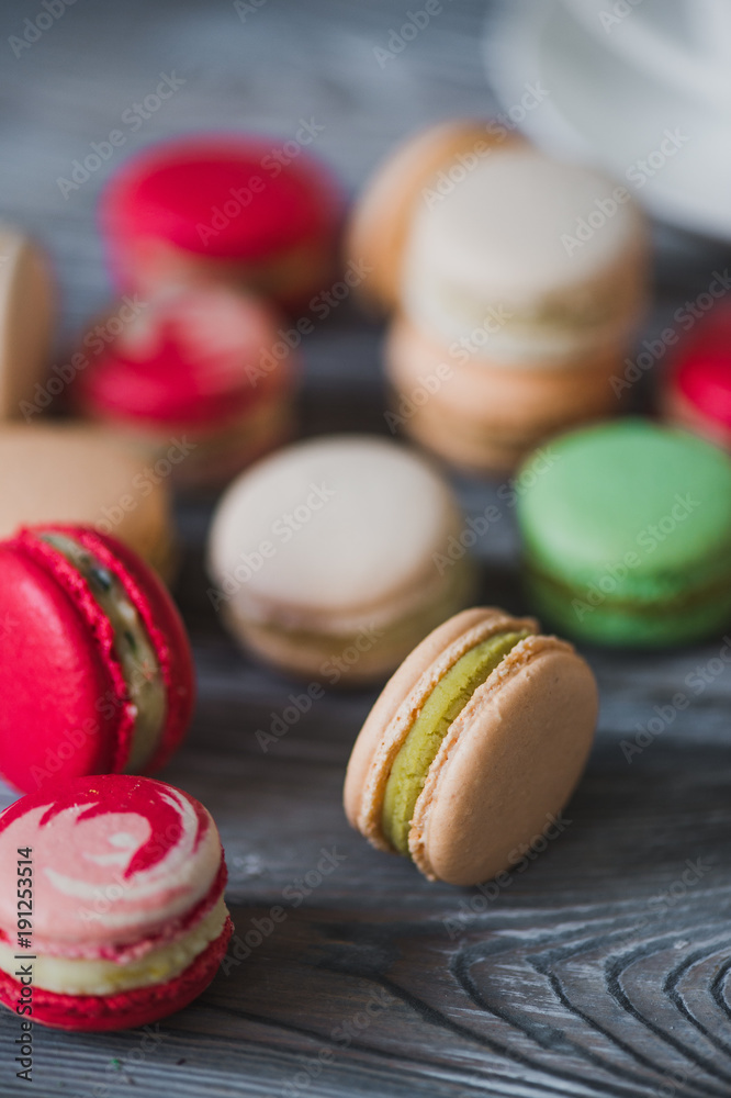 Macarons on rustic wood table, French candy meringuebased made with