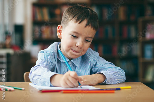 Preschool boy drawing