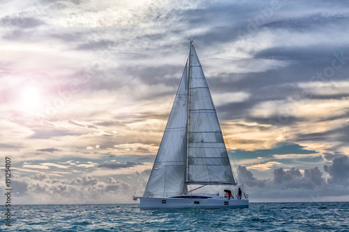 Obraz na płótnie sailboat at sunset in navigation, sail boat w salonie