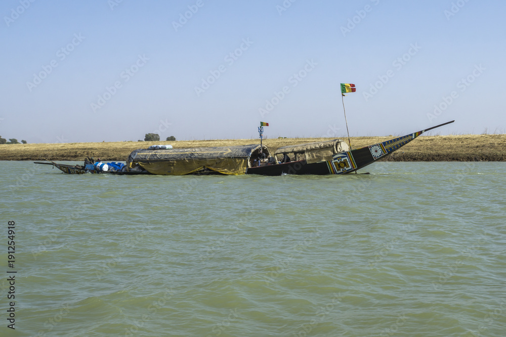 A pinasse river boat on the Niger River at Mopti in the early morning, Mali