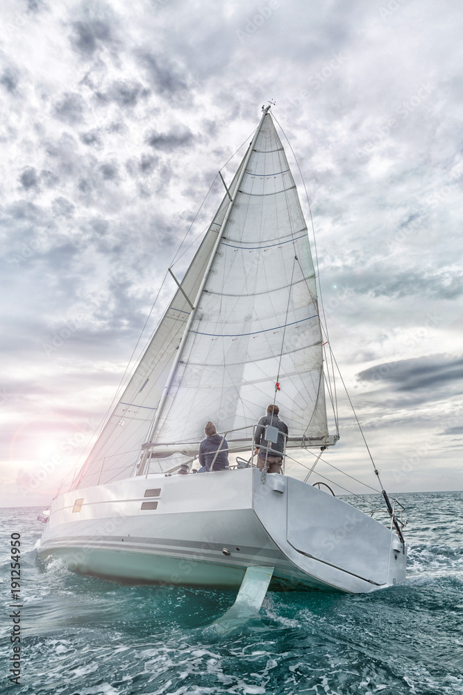 Fototapeta premium sailboat at sunset in navigation, sail boat