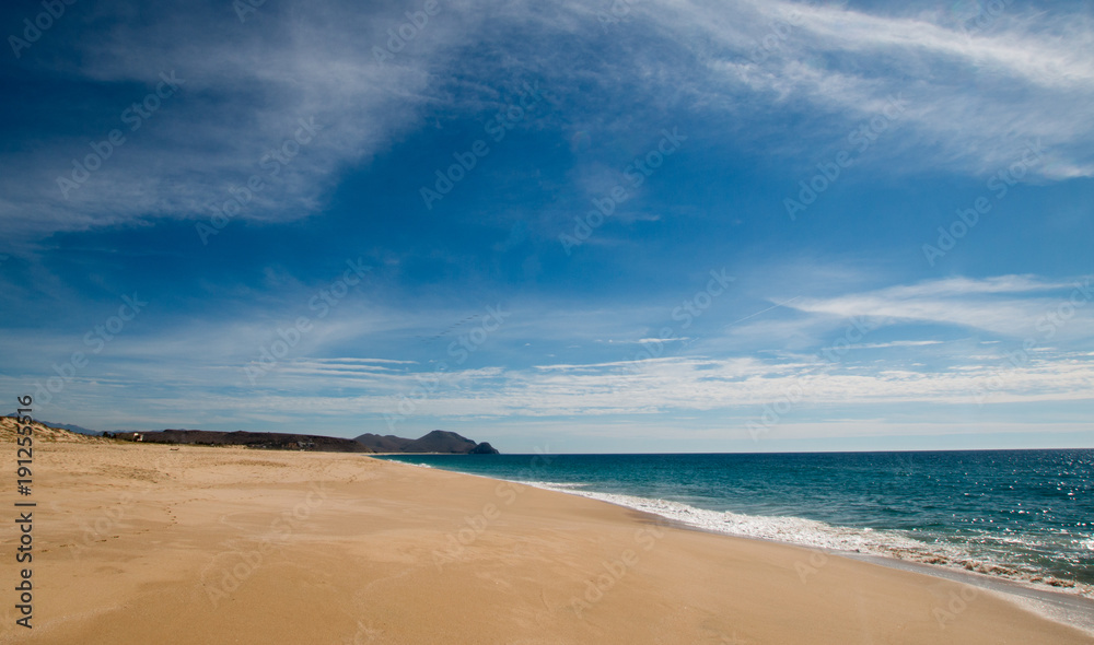 Beach under cirrus cloudscape at the Todos Santos artist community in Baja California Mexico BCS Beach under cirrus cloudscape at the Todos Santos artist community in Baja California Mexico BCS