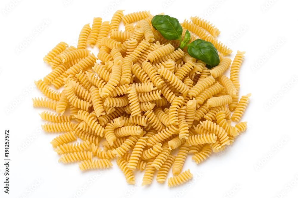 Uncooked fusilli pasta isolated white background. Uncooked fusilli pasta isolated white background.