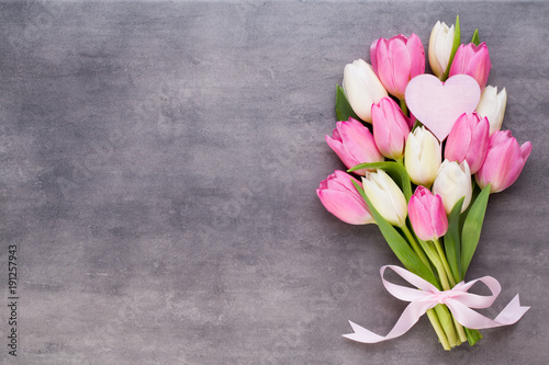 Fototapeta Naklejka Na Ścianę i Meble -  Mother's Day, woman's day, easter, pink tulips, presents on gray  background.