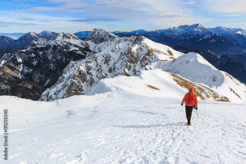 The mountaineer walking on the top of the ridge of the Begunjscica mountain, Slovenia