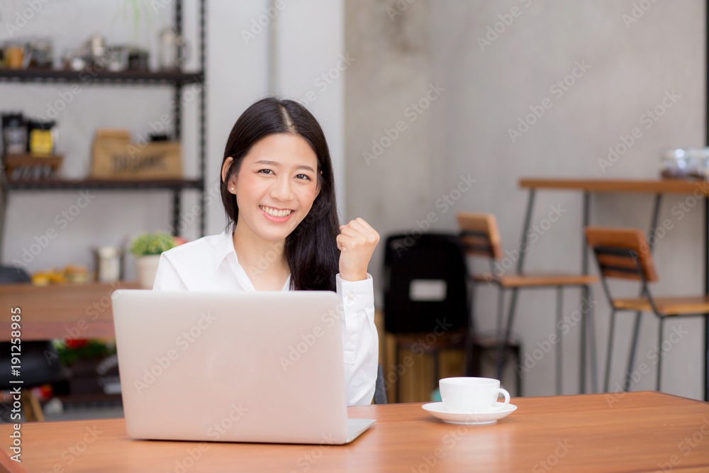 Beautiful asian young businesswoman excited and glad of success with laptop, girl using working computer coffee shop on desk, career freelance business concept. Beautiful asian young businesswoman excited and glad of success with laptop, girl using working computer coffee shop on desk, career freelance business concept.