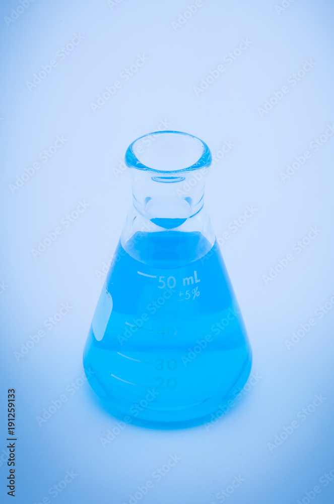 Test tubes with colorful liquids blue tone background Test tubes with colorful liquids blue tone background