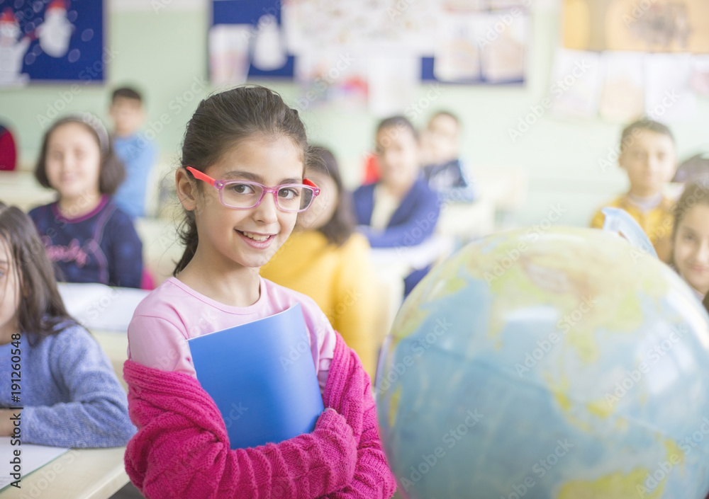 student girl hold notebook at the classroom with sphere student girl hold notebook at the classroom with sphere
