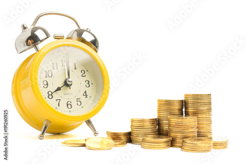Alarm clock with coin for growing isolated on white