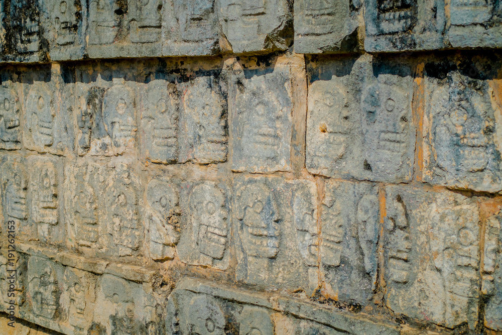 Close up of carved forms in the rock the enter of the Chichen Itza, one of the most visited archaeological sites in Mexico