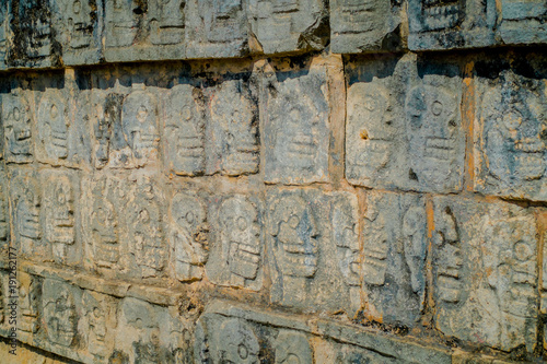 Close up of carved forms in the rock the enter of the Chichen Itza, one of the most visited archaeological sites in Mexico