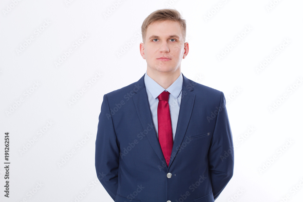 Serious businessman in blue suit and red tie isolated on white background. Business concept. Copy space and mock up Serious businessman in blue suit and red tie isolated on white background. Business concept. Copy space and mock up