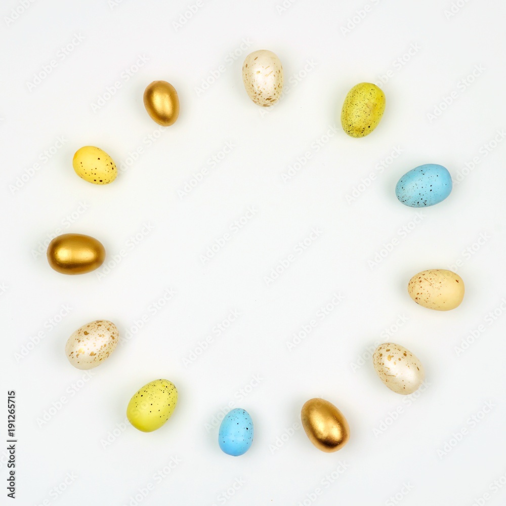 Circle of Easter Eggs over a white background. Simple, modern minimalist concept. Copy space. Circle of Easter Eggs over a white background. Simple, modern minimalist concept. Copy space.