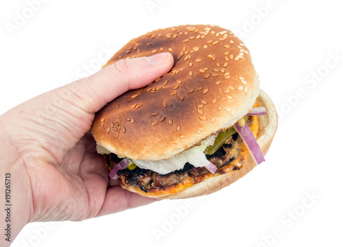 hand holding delicious cheeseburger