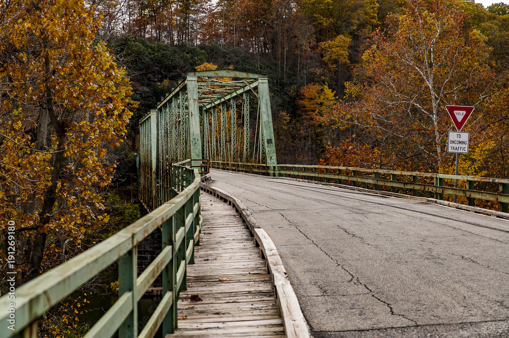 Fototapeta premium Historic One Lane Truss Crossing in Autumn - Layton Bridge - Pennsylvania