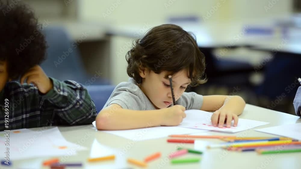 Small children study with teacher. Mixed race boys and girls young children in library with white male teacher. Education concept. Small children study with teacher. Mixed race boys and girls young children in library with white male teacher. Education concept.