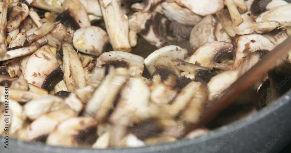 Mushrooms being cooked in pan s Mushrooms being cooked in pan s